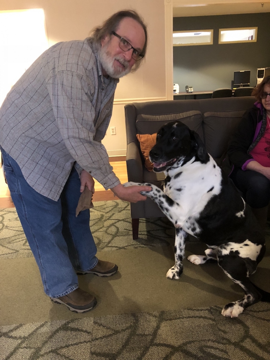 A service dog and his owner visits campus.