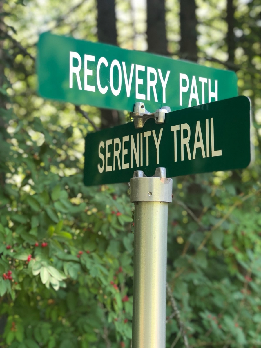 Customized road signs on Origami's paved campus trails. 