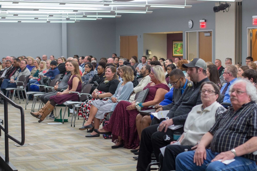 A full audience listens eagerly as the 2018 Evening of Reflections speakers share their stories