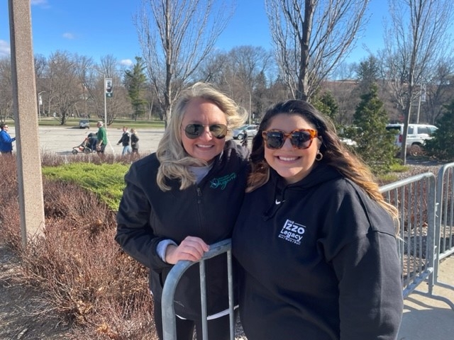 Origami Director of Development & Communications, Chanin Heise, and Lupe Izzo smile at the finish line of the 2022 Izzo Legacy Run/Walk/Roll event