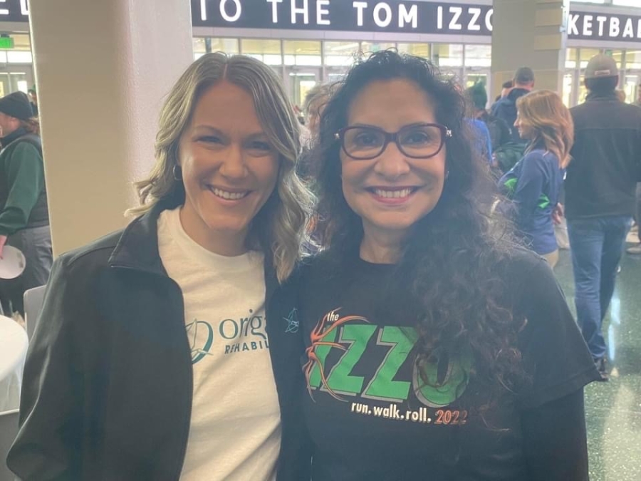 Origami President & CEO, Tammy Hannah, and Lupe Izzo smile for a photo before the 2022 race