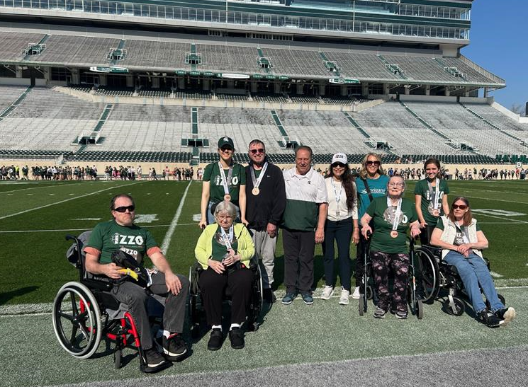 The Origami race crew with Tom & Lupe Izzo on the Spartan Football field