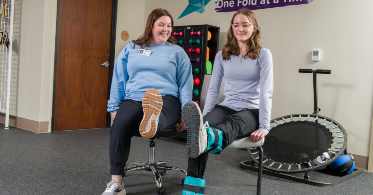 Young adult client works with Origami physical therapist