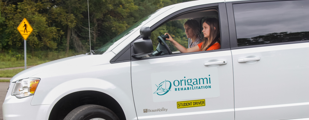 Origami Certified Driving Rehabilitation Specialist doing an on the road evaluation with a client